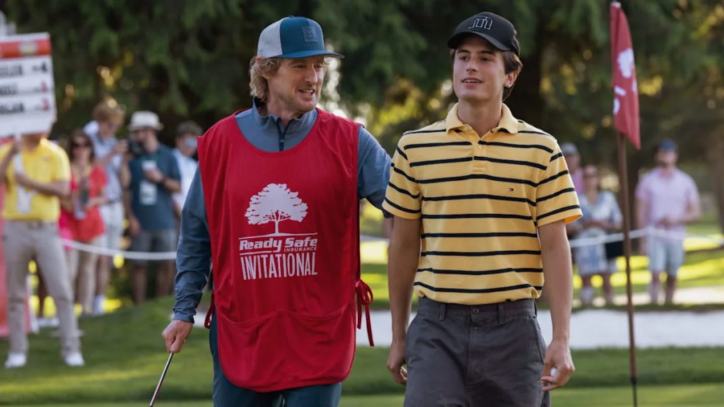 Peter Dager as Santiago Santi Wheeler holding a golf club in a scene from the Apple TV+ series Stick 2025